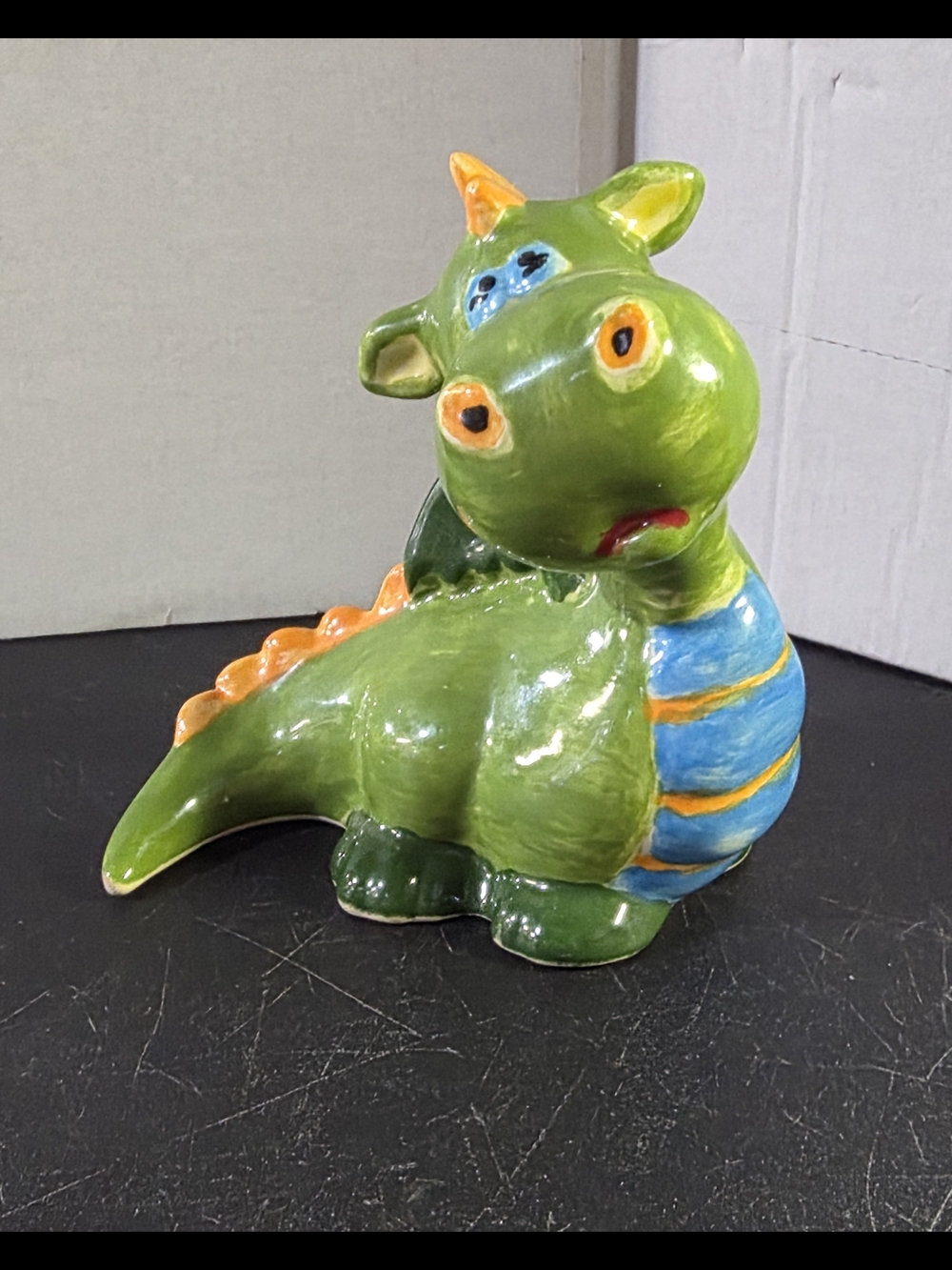 Whimsical Green Ceramic Dragon Figurine with Blue & Orange Accents